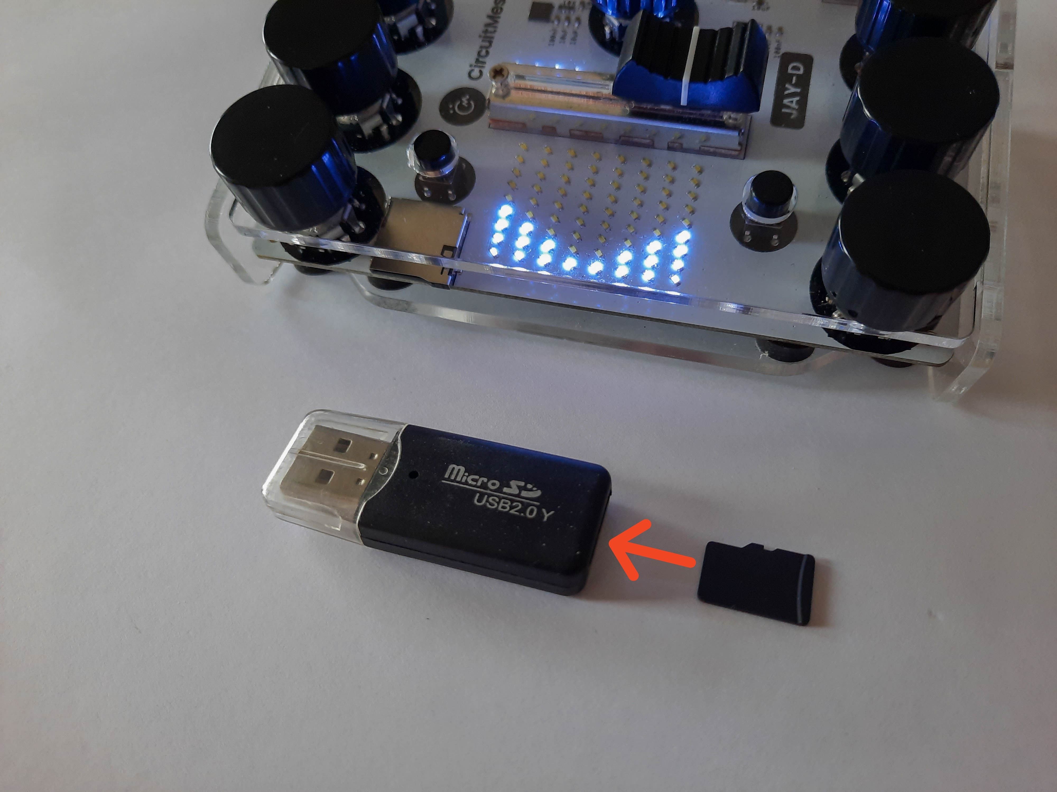 Insert the SD card into the USB