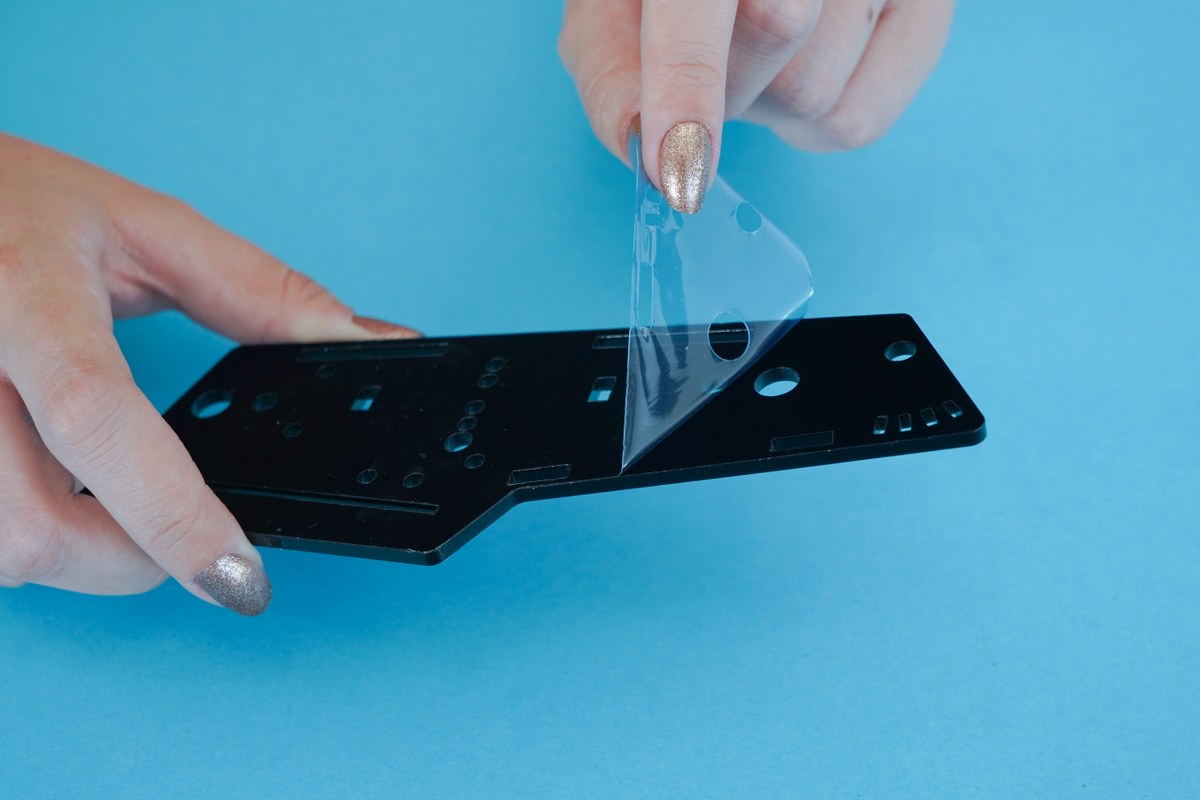 Peel off the protective layer from both sides of all the casing panels.