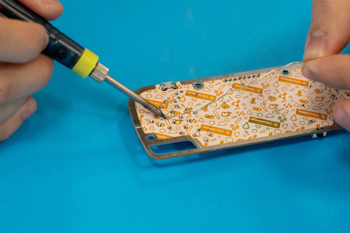 Soldering iron + a little bit of solder = connection!
